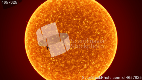 Image of sun with International Space Station