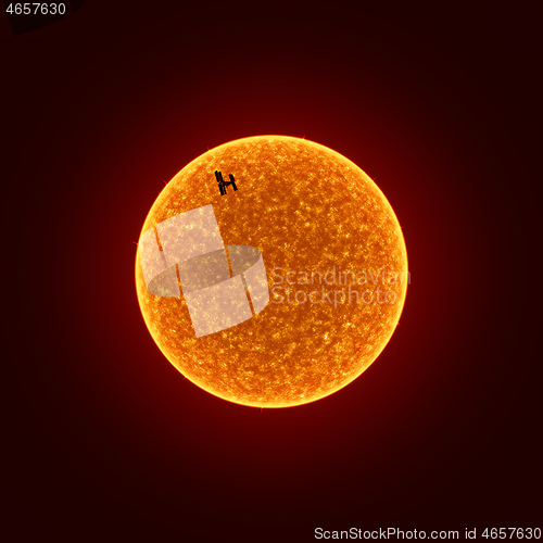 Image of sun with International Space Station