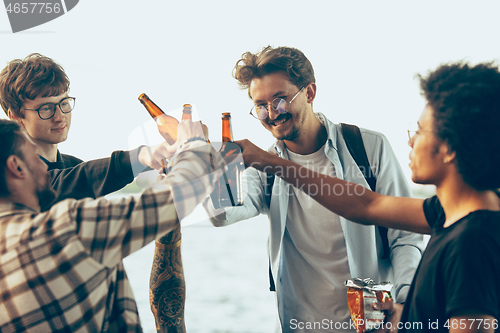 Image of Group of friends celebrating, resting, having fun and party in summer day