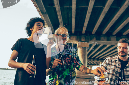 Image of Group of friends celebrating, resting, having fun and party in summer day