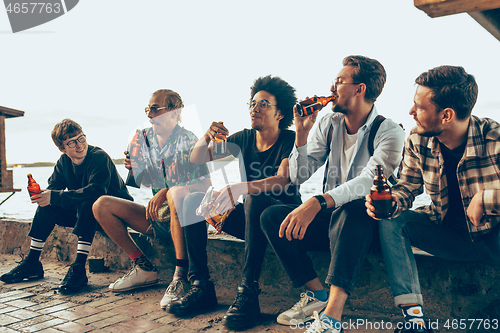 Image of Group of friends celebrating, resting, having fun and party in summer day