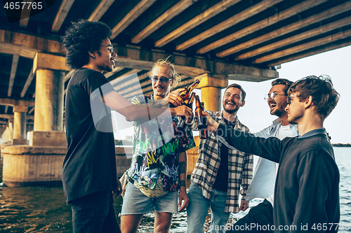 Image of Group of friends celebrating, resting, having fun and party in summer day