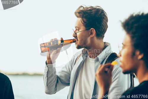 Image of Group of friends celebrating, resting, having fun and party in summer day