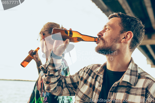 Image of Group of friends celebrating, resting, having fun and party in summer day