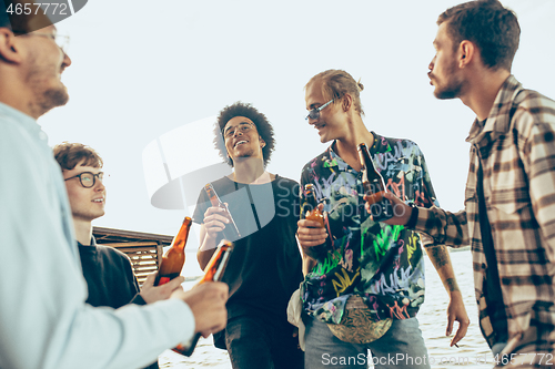 Image of Group of friends celebrating, resting, having fun and party in summer day