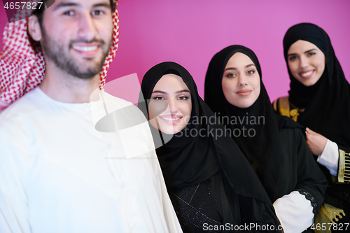 Image of portrait of young muslim people isolated on pink