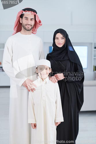 Image of portrait of young happy arabian muslim family