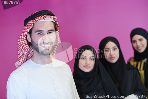 Image of portrait of young muslim people isolated on pink