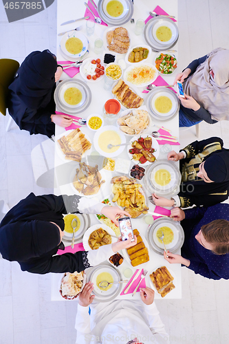 Image of muslim family having a Ramadan feast top view