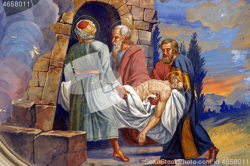 Image of Jesus is laid in the tomb