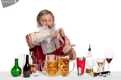 Image of Expert barman with beer at studio