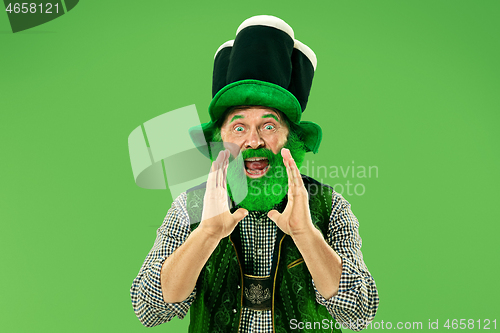 Image of A man in a leprechaun hat at studio. He celebrates St. Patrick\'s Day.