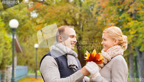 Image of smiling couple in autumn park