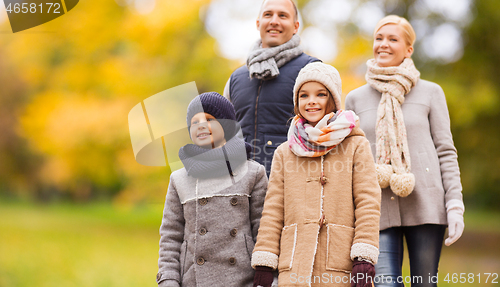 Image of happy family in autumn park