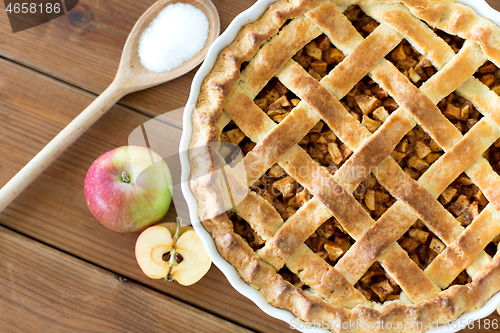 Image of close up of apple pie on wooden table