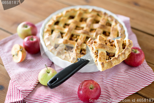 Image of close up of apple pie piece on kitchen knife