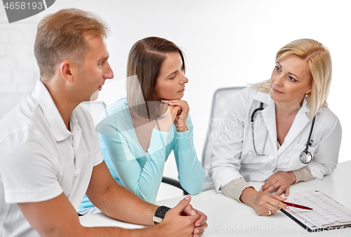 Image of couple visiting doctor at family planning clinic