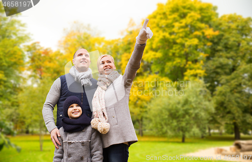 Image of happy family in autumn park