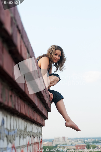 Image of Pretty girl on roof