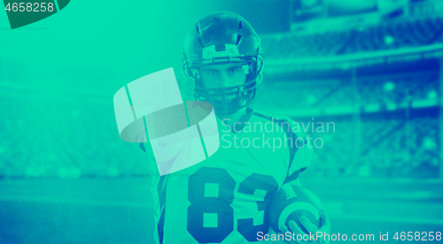 Image of portrait of confident American football player