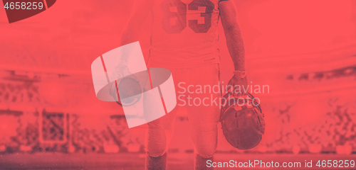 Image of closeup American Football Player isolated on big modern stadium