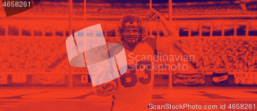 Image of american football player celebrating touchdown