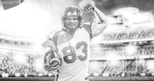 Image of american football player celebrating touchdown