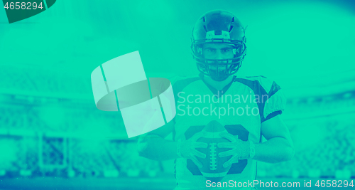 Image of American Football Player isolated on big modern stadium field