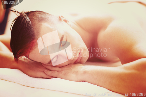 Image of man have relaxing massage