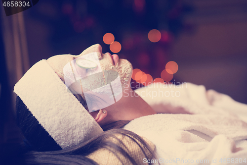 Image of woman in spa  with cosmetic mask