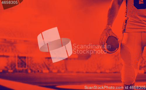 Image of closeup American Football Player isolated on big modern stadium