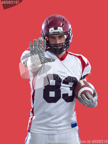 Image of portrait of confident American football player