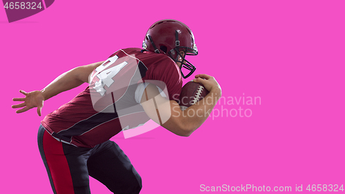 Image of American football Player running with the ball