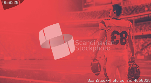 Image of American Football Player isolated on big modern stadium field