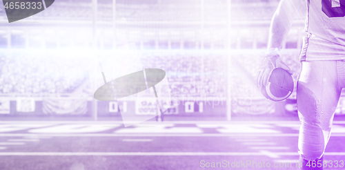 Image of closeup American Football Player isolated on big modern stadium