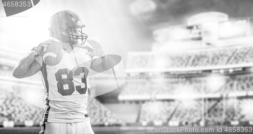 Image of American Football Player isolated on big modern stadium field