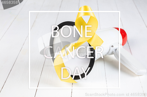 Image of Yellow ribbon symbolic color for Sarcoma Bone cancer awareness and suicide prevention