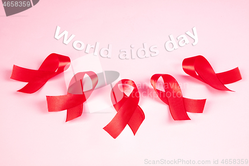 Image of Aids Awareness Sign Red Ribbon. World Aids Day concept.