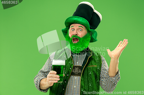 Image of A man in a leprechaun hat at studio. He celebrates St. Patrick\'s Day.