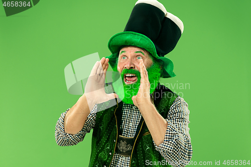 Image of A man in a leprechaun hat at studio. He celebrates St. Patrick\'s Day.