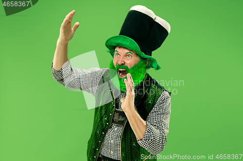 Image of A man in a leprechaun hat at studio. He celebrates St. Patrick\'s Day.