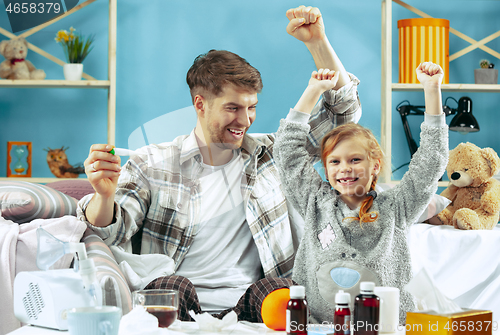 Image of Sick man with daughter at home. The ill family.