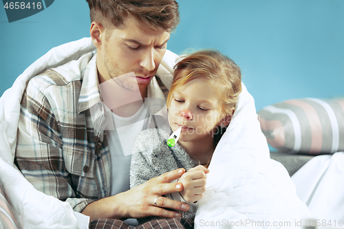 Image of Sick man with daughter at home. The ill family.