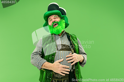 Image of A man in a leprechaun hat at studio. He celebrates St. Patrick\'s Day.