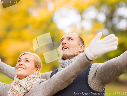 Image of smiling couple in autumn park