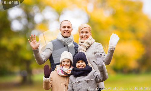 Image of happy family in autumn park