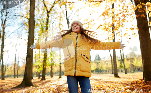 Image of happy girl at autumn park