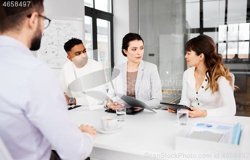 Image of recruiters having job interview with employee