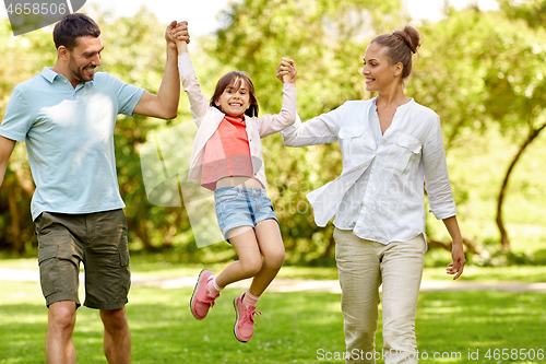 Image of happy family walking in summer park