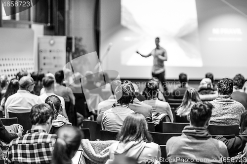 Image of Business speaker giving a talk at business conference event.